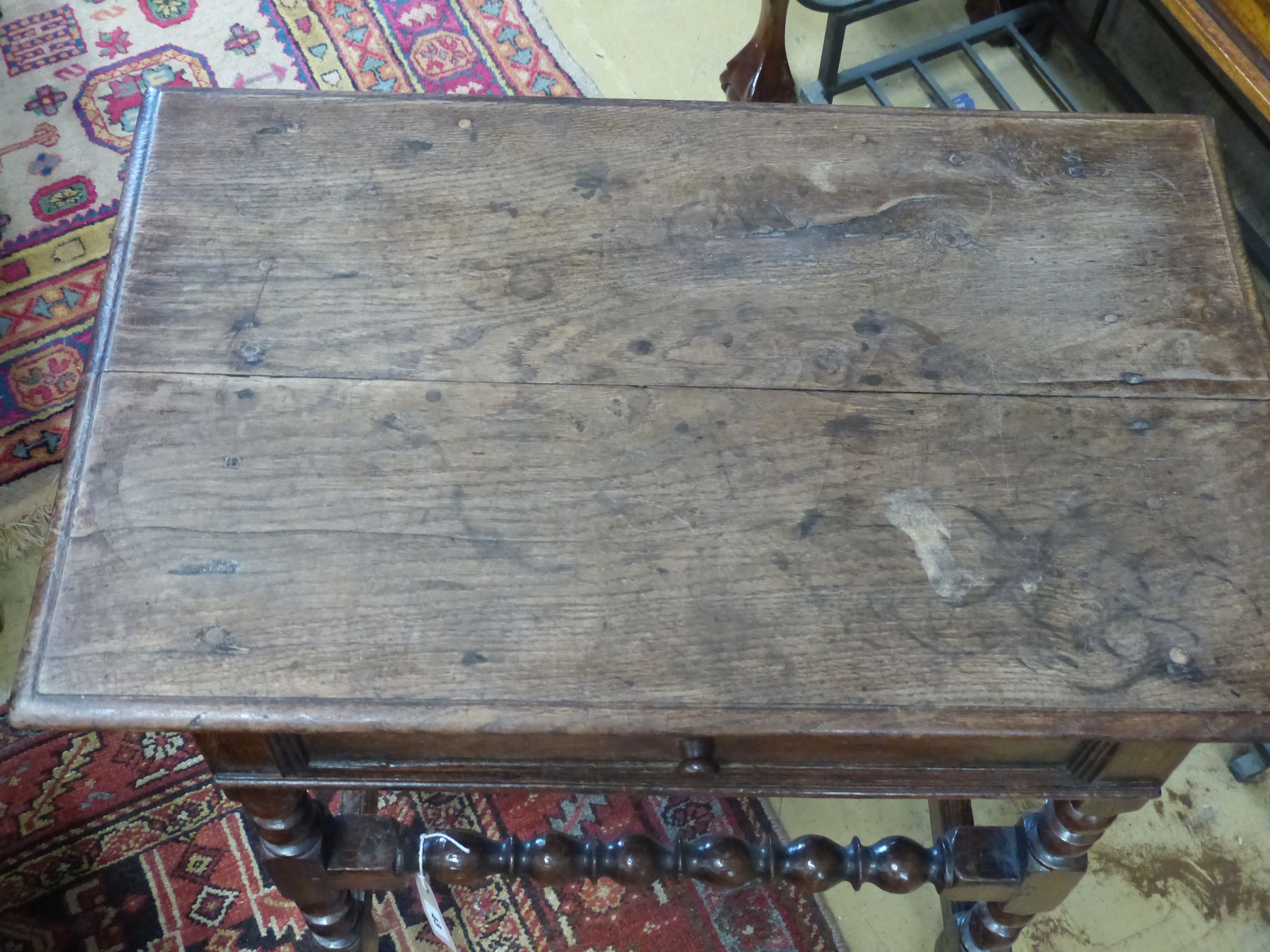 An oak side table, 18th century and later, width 76cm, depth 47cm, height 75cm